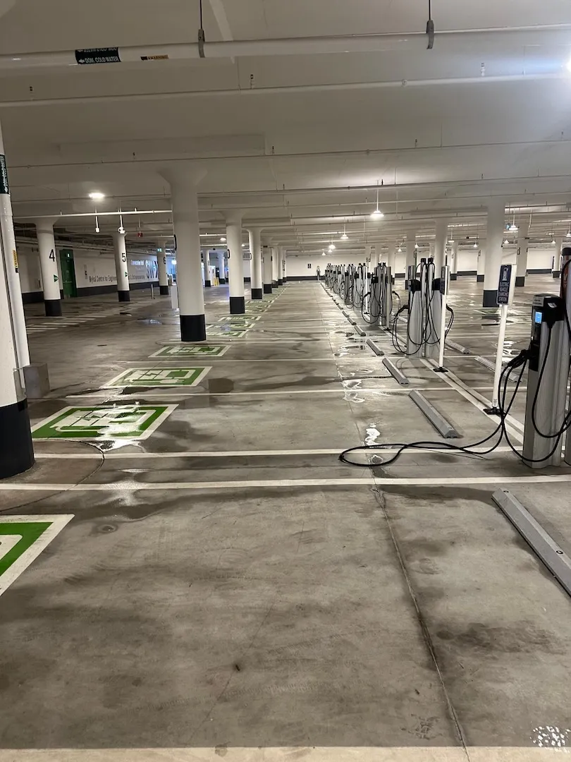 Clean EV charger zone in garage after deep pressure washing